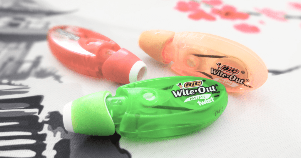 Close-up of three Wite-Out Mini Twist from Bic in green, yellow and red colors.