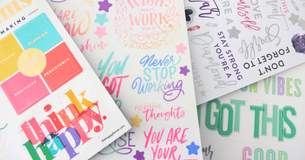 Colorful flatlay of motivational stickers.