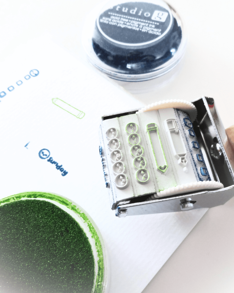 A close of the roller stamp being used.