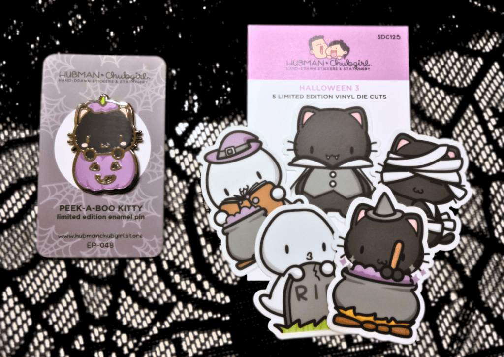 An image showing the detail of 5 die-cut stickers and one pin from Hubman & Chubgirl that are part of the Halloween 2023 bundle.