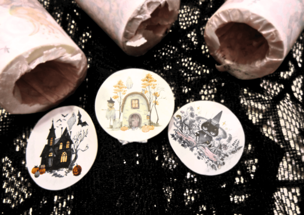 An arrangement of the three stickers that keep the sets wrapped and that showcases an image from the collection they come from.