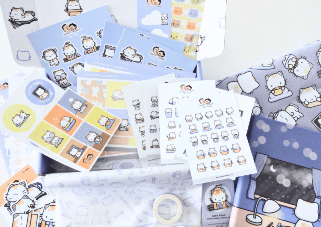 Flatlay of the entire Cozy Cat box set's content.