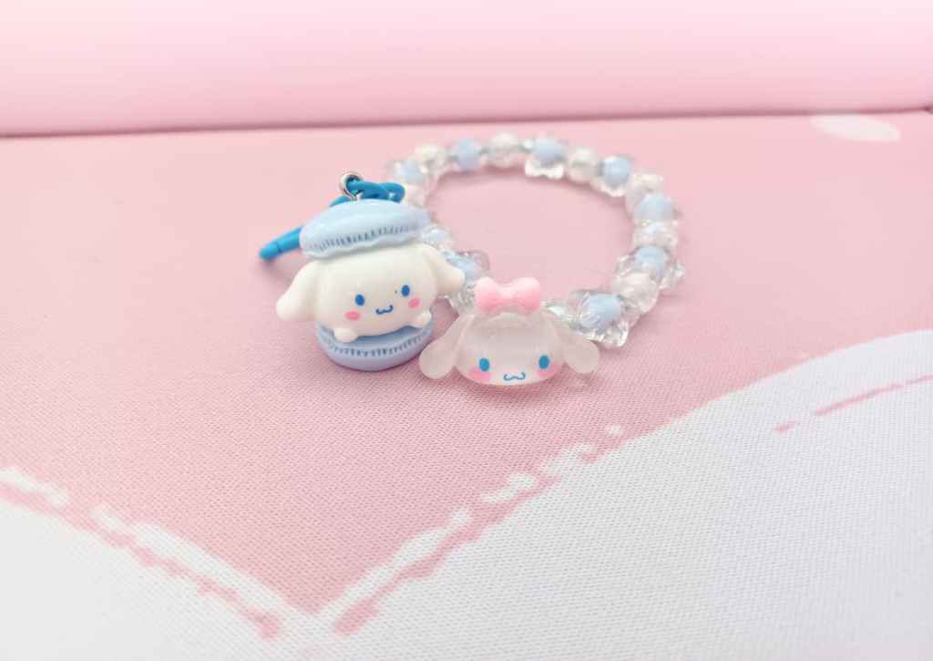Cinnamoroll as a macaron zipper charm and bracelet with plastic beads and a Cinnamoroll head charm
