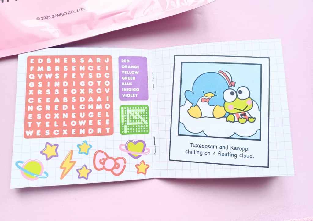 Open activity booklet showing an easy word search and a large picture of Sanrio characters Tuxedosam and Keroppi.