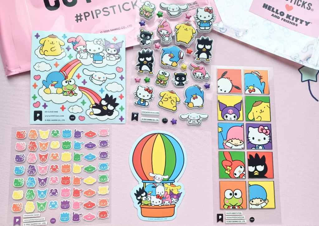 Flatlay of multiple sticker type sheets and a mix of Sanrio characters