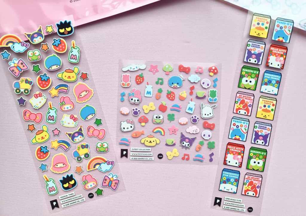 Flatlay of sticker sheets displaying a wide array of Sanrio characters