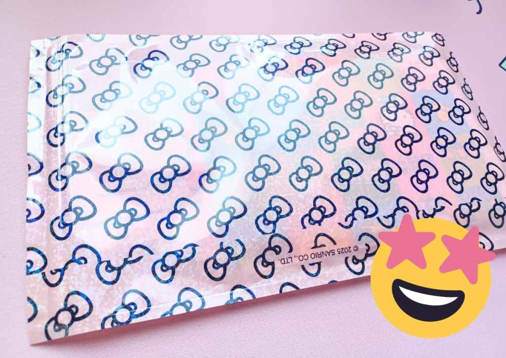 Pink resealable pouch with a bow design and a sparkly material