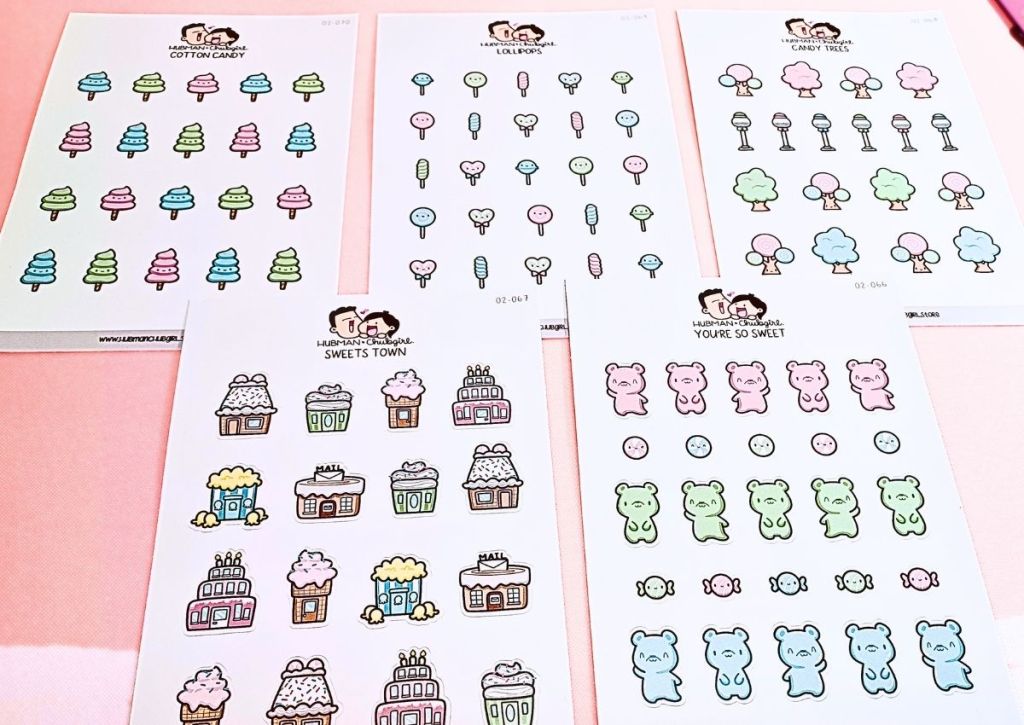 Five sticker sheets displaying an array of cute and colorful candy designs ranging from gummy bears to lollipops to cupcake houses.