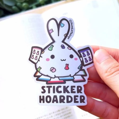 A sticker representing a hand drawn bunny covered in stickers and sticker sheets.