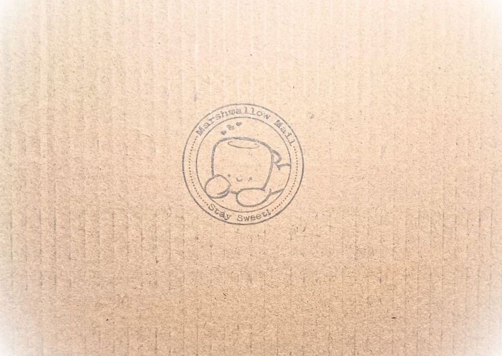 A stamp on carboard with a cute character and the words "Stay sweet"