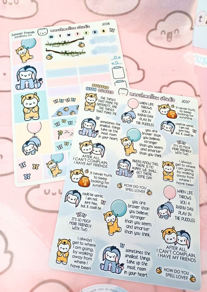 Two large sticker sheets with a variety of designs inspired by Winnie the Pooh and friends.
