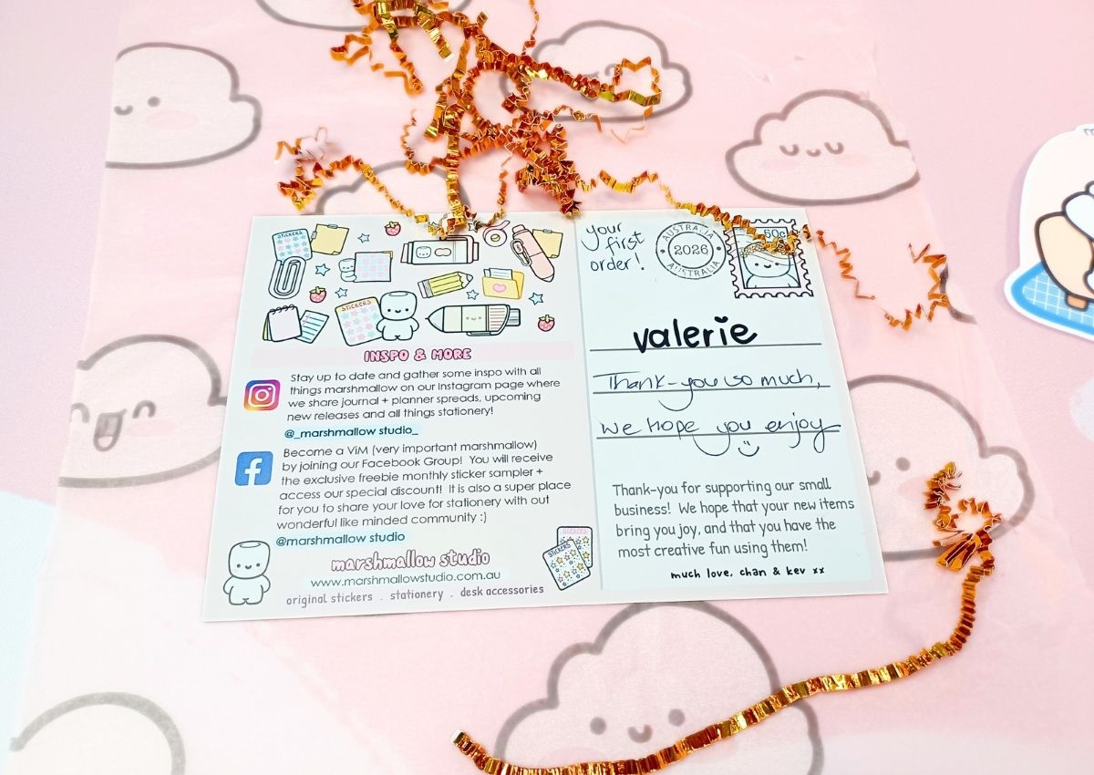 A cute, pastel-colored postcard with shop information on one half and a sweet handwritten message on the other half.