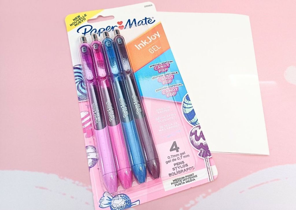 Four candy-colored pens in their colorful packaging.