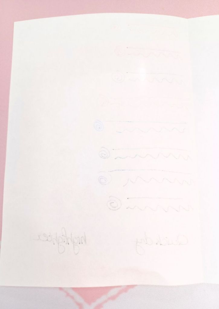 A pristine white sheet that shows some writing ghosting through.