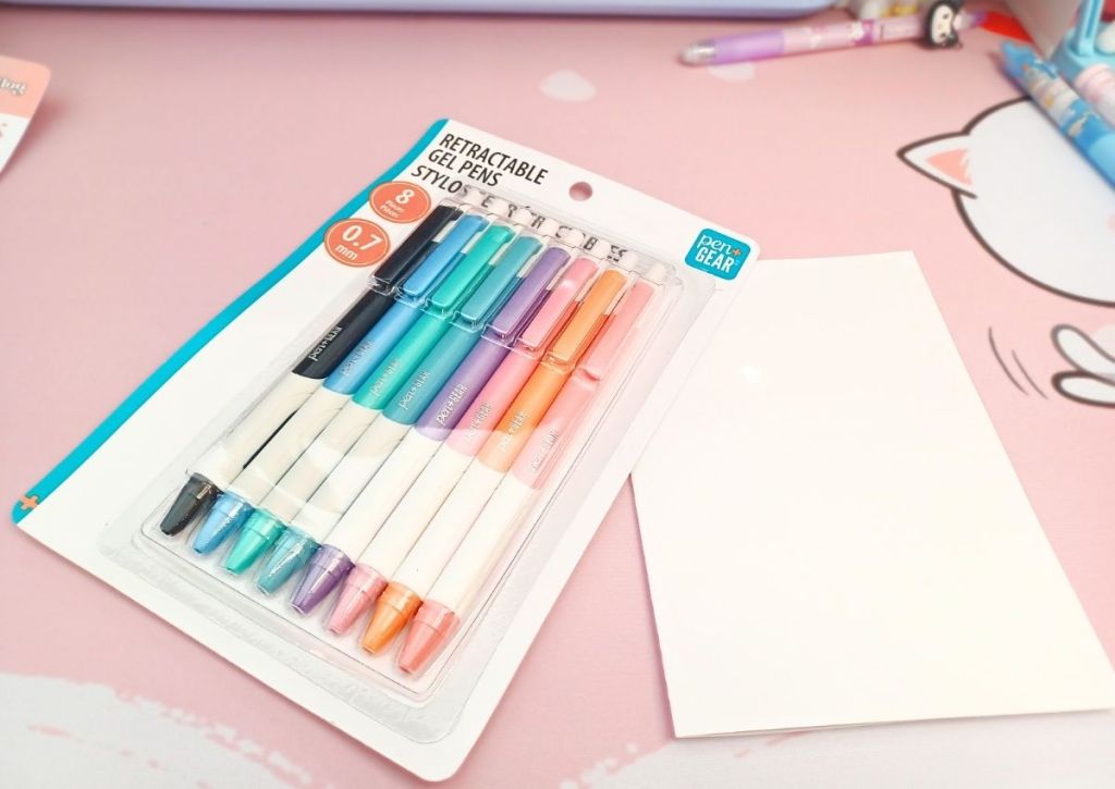 Eight pens of different colors in their simple, almost bland packaging.