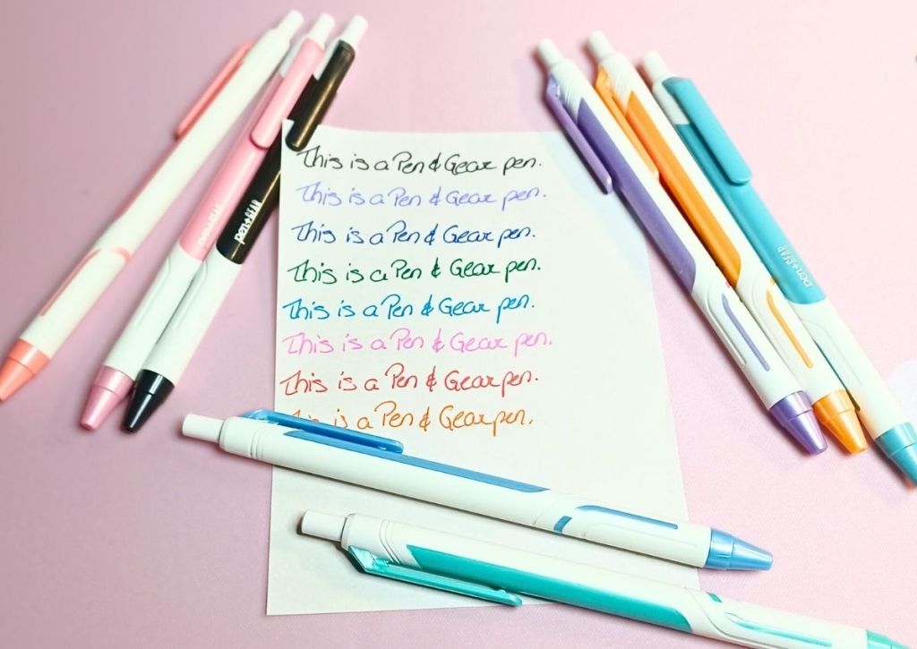 A page with a writing test repeated over and over, surrounded by the colorful Pen & Gear pens.