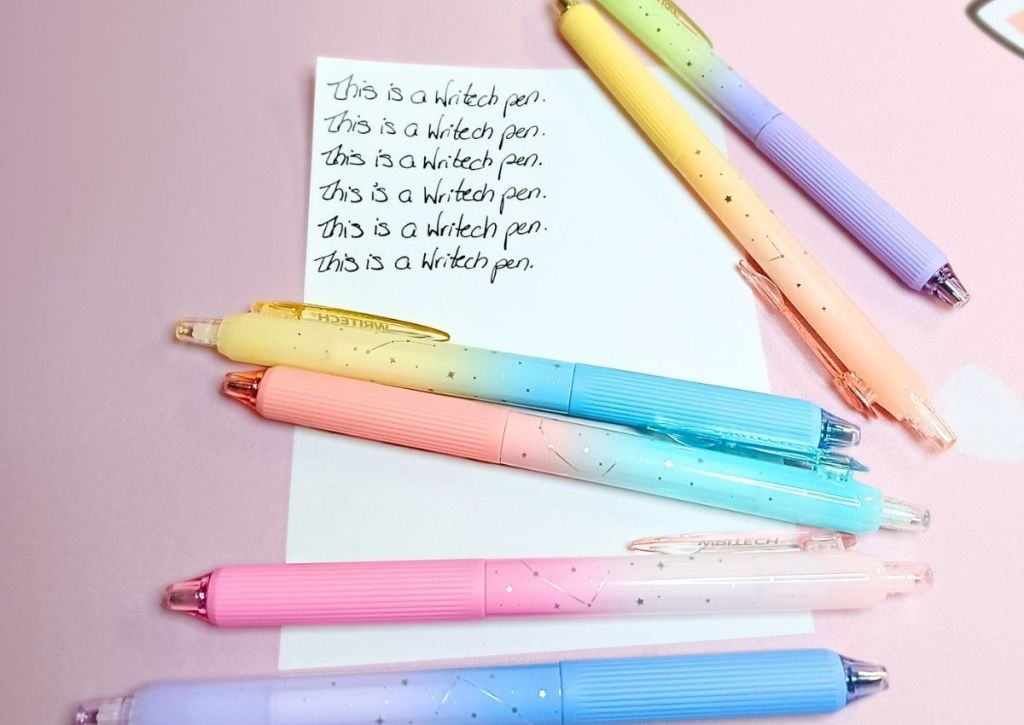 A page with a writing test repeated over and over, surrounded by the colorful Writech Nebula pens.