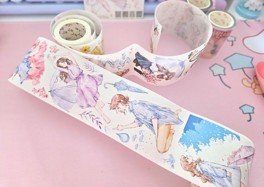 A variety of washi tape stickers printed on two rolls and featuring watercolor designs of girls on various rainy backgrounds.