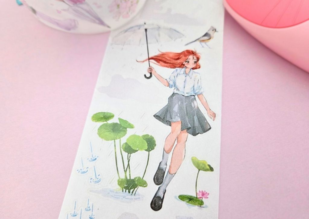 A girl wearing a white shirt and a gray skirt, with her red hair flowing in the wind, skipping in the rain and holding a gray umbrella.