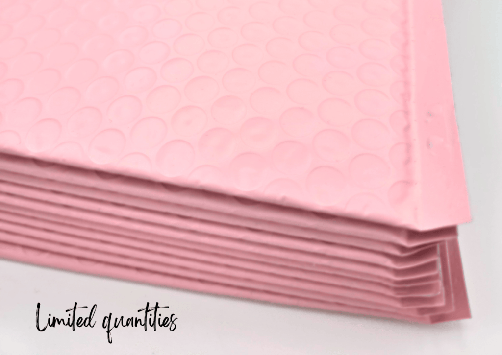 A stack of pink bubble mailers lies on a white surface. Text in the lower left corner reads Limited quantities.