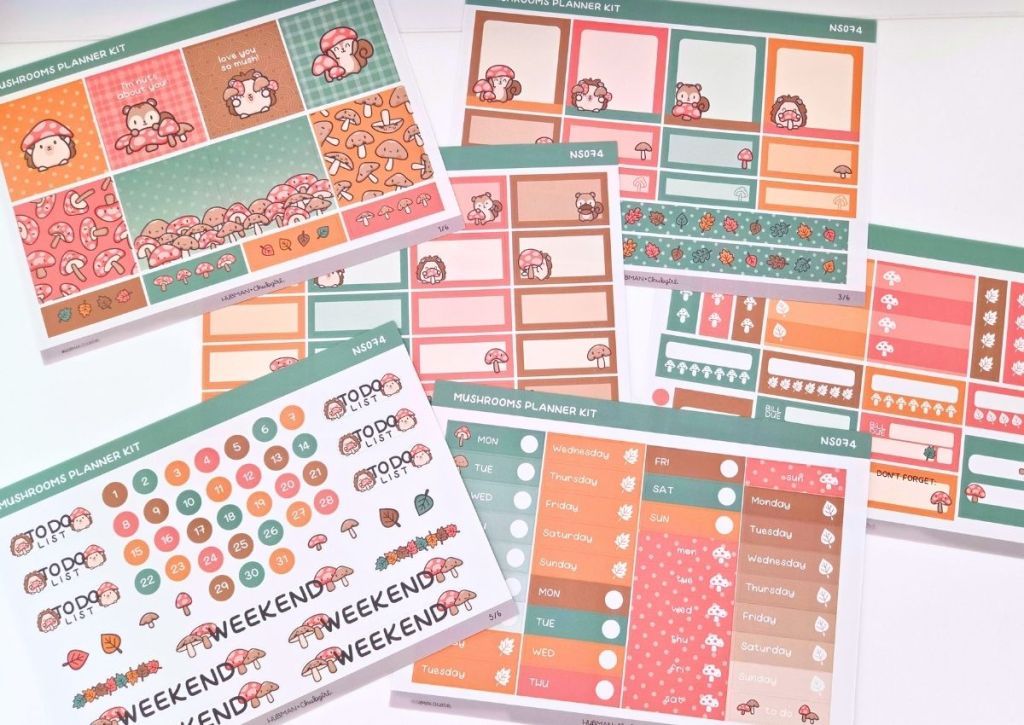 Six sheets of colorful mushroom-themed planner stickers, including cute cartoon animals, labels, icons, checklists, and decorative boxes in shades of orange, green, and pink, arranged on a white surface.
