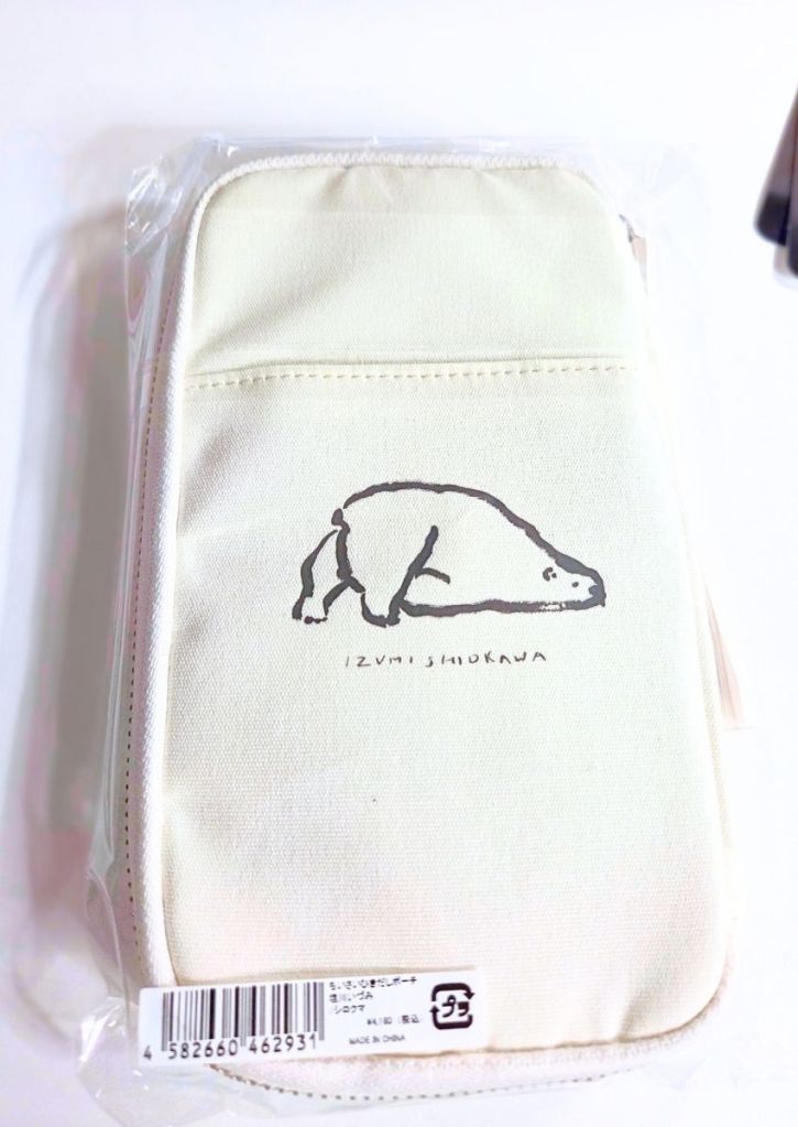 Cream-colored zippered pencil case in plastic packaging featuring a line-art illustration of a polar bear and the text Izumi Shirokawa.